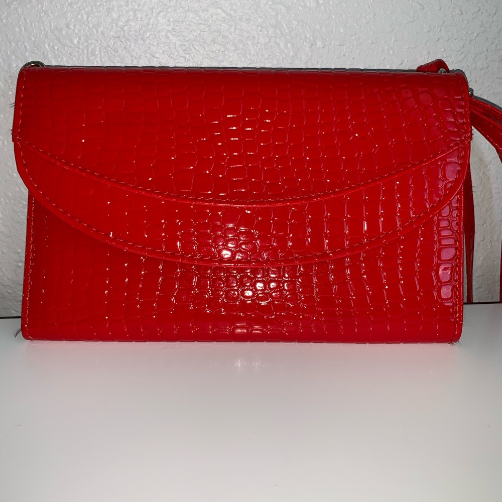 Red crocodile print clutch purse